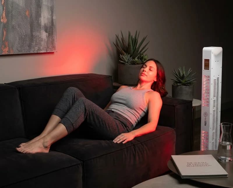 Woman relaxing on a sofa with a RedLife Pro 300 panel